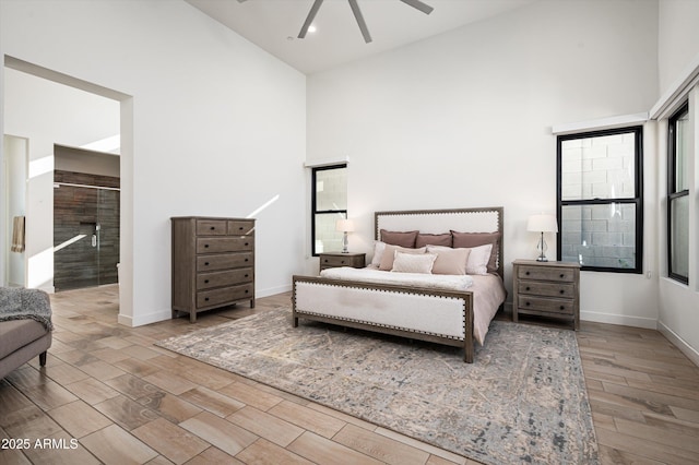 bedroom featuring ceiling fan and high vaulted ceiling