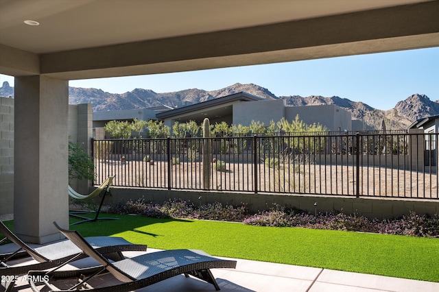 view of patio / terrace featuring a mountain view