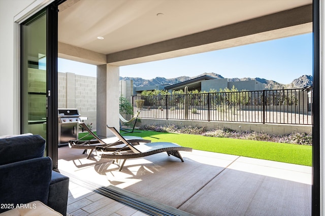 view of patio featuring area for grilling and a mountain view