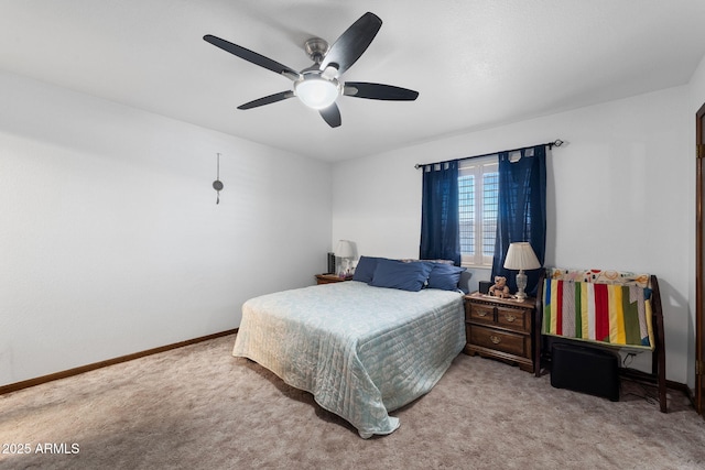 carpeted bedroom featuring a ceiling fan and baseboards