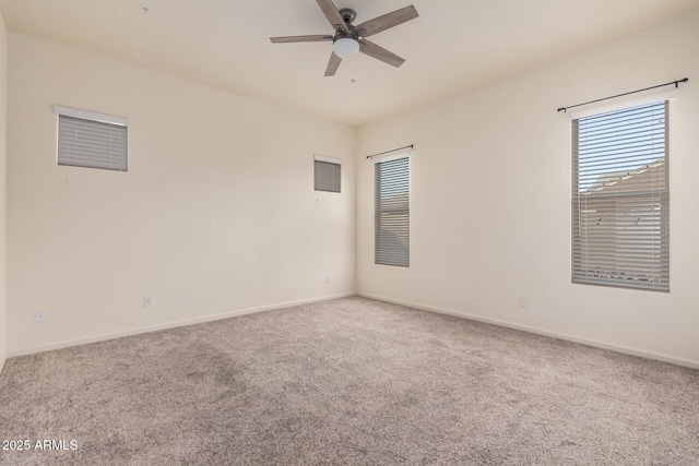 spare room featuring ceiling fan and carpet flooring