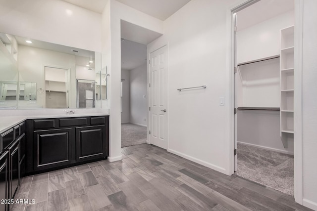 bathroom featuring hardwood / wood-style flooring and vanity