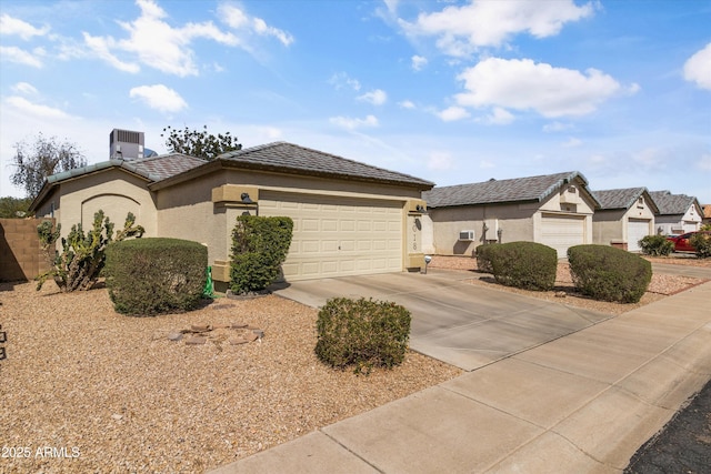 view of front of property featuring central AC unit, stucco siding, concrete driveway, a garage, and a tile roof