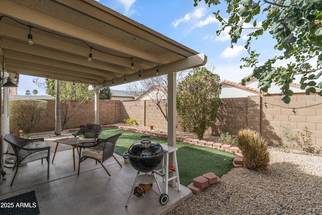 view of patio featuring area for grilling and a fenced backyard