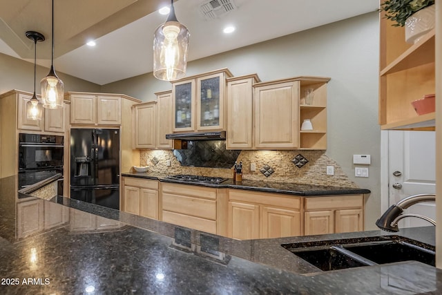 kitchen featuring black appliances, visible vents, a sink, and light brown cabinetry