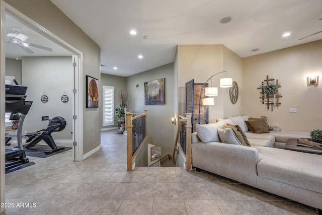 living room featuring light tile patterned floors, ceiling fan, baseboards, and recessed lighting