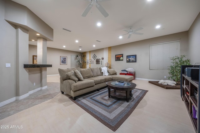 living room featuring baseboards, visible vents, a ceiling fan, and recessed lighting