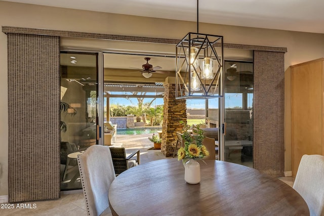 tiled dining area featuring a ceiling fan