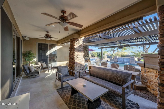 view of patio with exterior kitchen, outdoor lounge area, and a ceiling fan