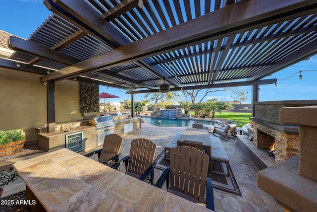 view of patio / terrace featuring wine cooler, an outdoor stone fireplace, outdoor dining area, an outdoor kitchen, and a pergola