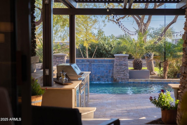outdoor pool featuring an outdoor kitchen