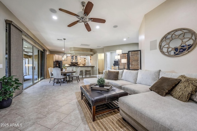 living area with a ceiling fan, recessed lighting, and light tile patterned flooring