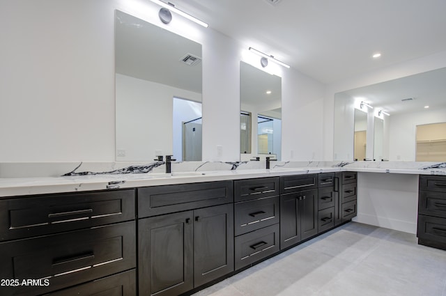 bathroom featuring vanity and walk in shower