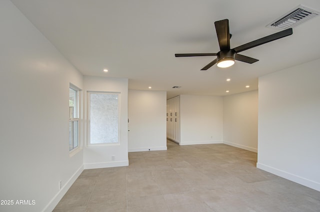 spare room with ceiling fan