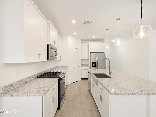 4151 W Lisa Ln, San Tan Valley, AZ 85144 - kitchen featuring stainless steel appliances, a sink, white cabinets, a center island with sink, and pendant lighting