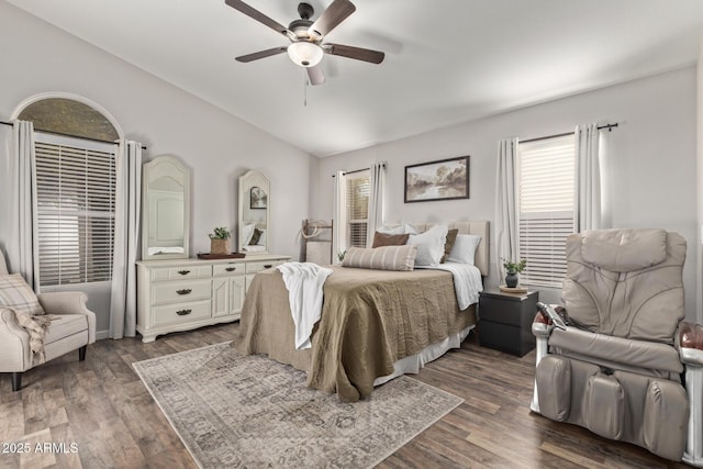 bedroom with dark wood-type flooring, ceiling fan, and vaulted ceiling