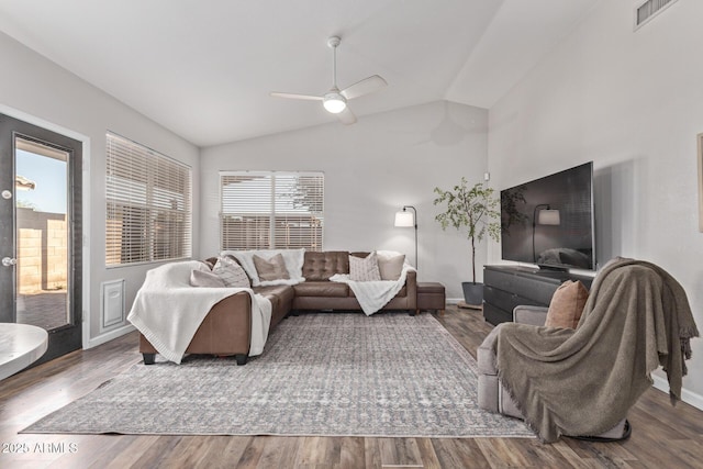 living room with hardwood / wood-style flooring, ceiling fan, and lofted ceiling