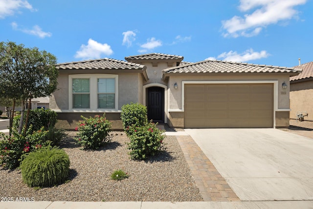 25974 W Horsham Dr, Buckeye, AZ 85396 - mediterranean / spanish-style house with stucco siding, a garage, concrete driveway, and a tile roof