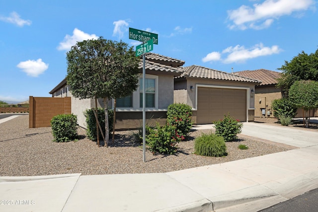 25974 W Horsham Dr, Buckeye, AZ 85396 - view of front of property featuring stucco siding, an attached garage, driveway, and a tile roof