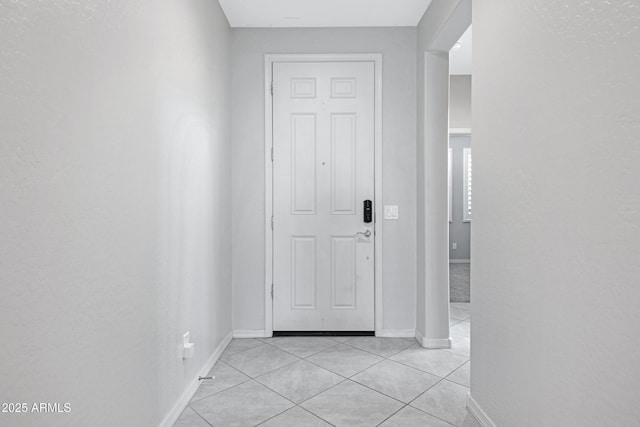 25974 W Horsham Dr, Buckeye, AZ 85396 - doorway to outside with light tile patterned flooring and baseboards