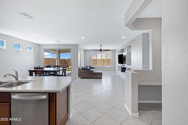 25974 W Horsham Dr, Buckeye, AZ 85396 - kitchen with dishwasher, light tile patterned floors, light countertops, recessed lighting, and open floor plan