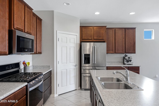 25974 W Horsham Dr, Buckeye, AZ 85396 - kitchen featuring stainless steel appliances, light countertops, light tile patterned floors, and recessed lighting
