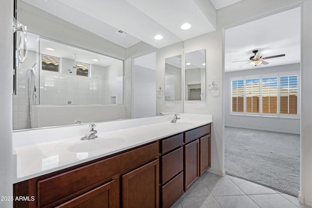 25974 W Horsham Dr, Buckeye, AZ 85396 - full bathroom featuring double vanity, tile patterned floors, tiled shower, a ceiling fan, and recessed lighting