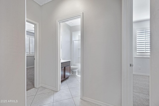 25974 W Horsham Dr, Buckeye, AZ 85396 - corridor with light tile patterned floors and baseboards