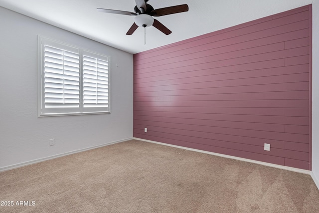 25974 W Horsham Dr, Buckeye, AZ 85396 - empty room featuring ceiling fan, carpet, and wooden walls