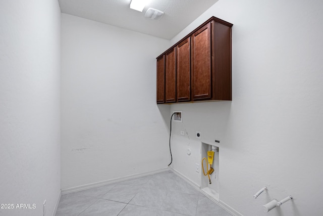25974 W Horsham Dr, Buckeye, AZ 85396 - laundry room with gas dryer hookup, cabinet space, electric dryer hookup, light tile patterned flooring, and washer hookup