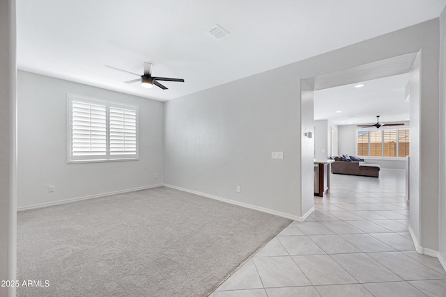 25974 W Horsham Dr, Buckeye, AZ 85396 - spare room with a ceiling fan, light carpet, light tile patterned flooring, and recessed lighting