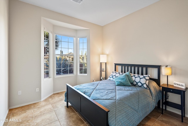 13724 N Wild Hazel Ln, Marana, AZ 85658 - bedroom featuring visible vents, baseboards, and tile patterned floors