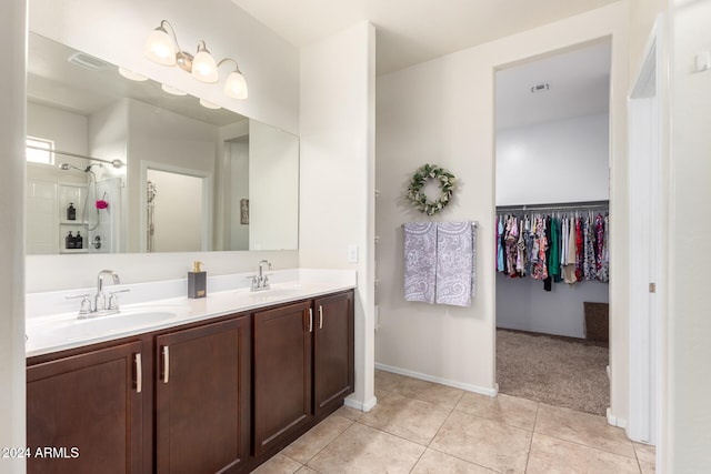 bathroom featuring tile patterned flooring and vanity