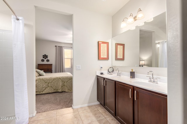 bathroom featuring tile patterned flooring and vanity