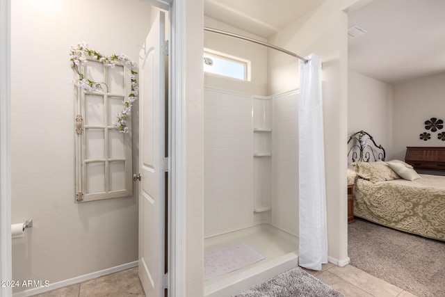 bathroom featuring a shower with shower curtain and tile patterned floors