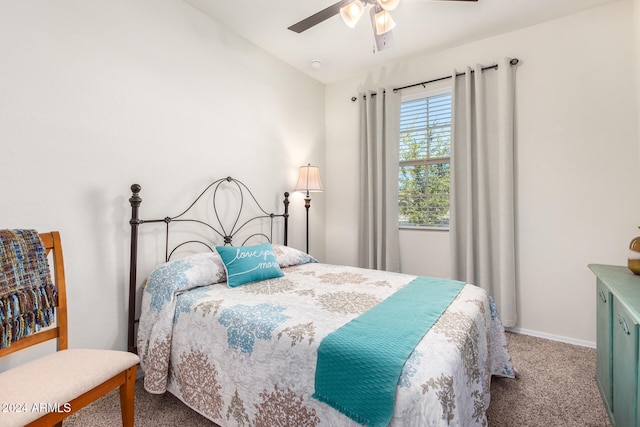 bedroom featuring ceiling fan and carpet