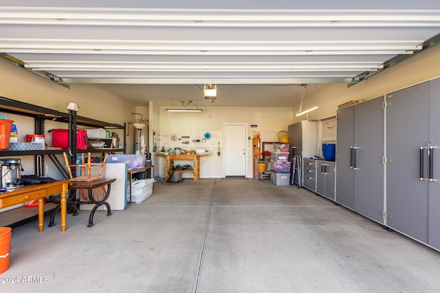 garage featuring a workshop area and a garage door opener