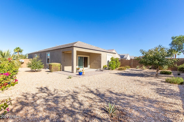 back of property with a patio area