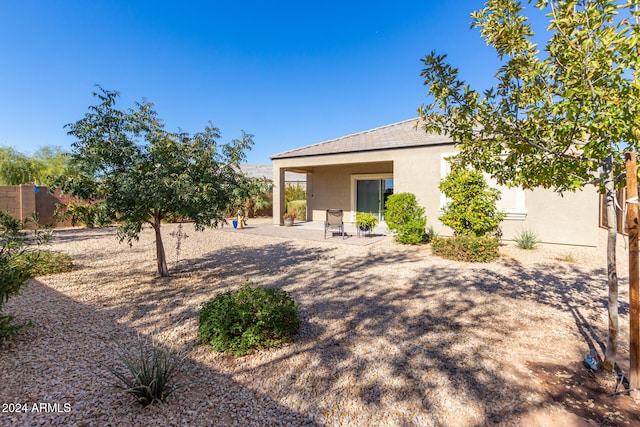 back of house with a patio area