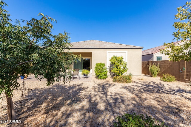 rear view of house featuring a patio