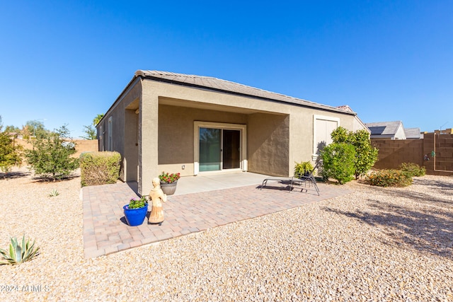 back of house featuring a patio