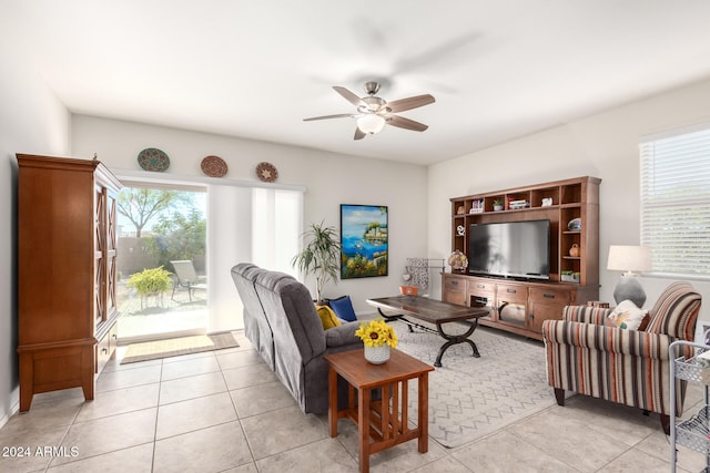 tiled living room featuring ceiling fan