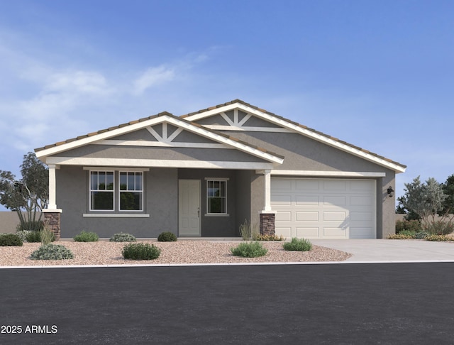 15794 W Cheryl Dr, Waddell, AZ 85355 - view of front of house featuring stucco siding, driveway, and a garage