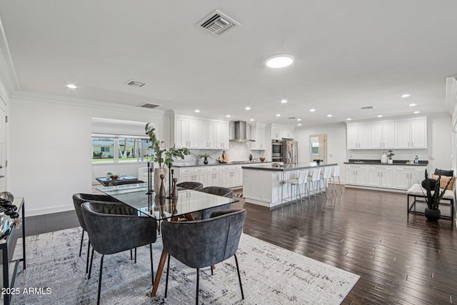 615 E Winter Dr, Phoenix, AZ 85020 - dining area with ornamental molding, recessed lighting, and dark wood-style floors