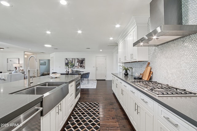 615 E Winter Dr, Phoenix, AZ 85020 - kitchen with wall chimney range hood, stainless steel appliances, dark wood-style floors, crown molding, and decorative backsplash