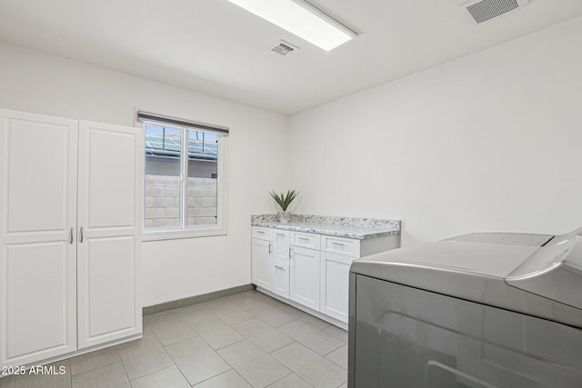 615 E Winter Dr, Phoenix, AZ 85020 - washroom featuring washer / dryer and cabinet space