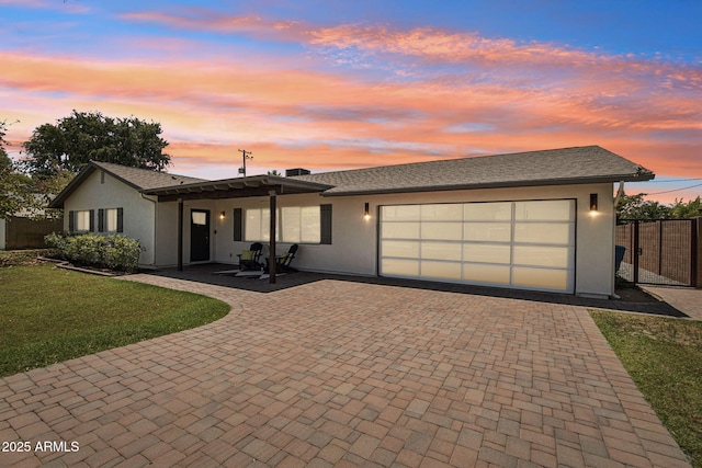 615 E Winter Dr, Phoenix, AZ 85020 - single story home with an attached garage, decorative driveway, and stucco siding