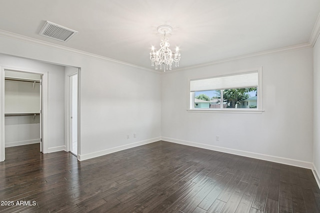 615 E Winter Dr, Phoenix, AZ 85020 - unfurnished bedroom featuring a chandelier, crown molding, dark wood finished floors, and a closet