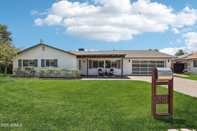 615 E Winter Dr, Phoenix, AZ 85020 - ranch-style home featuring driveway, a garage, a front lawn, and stucco siding