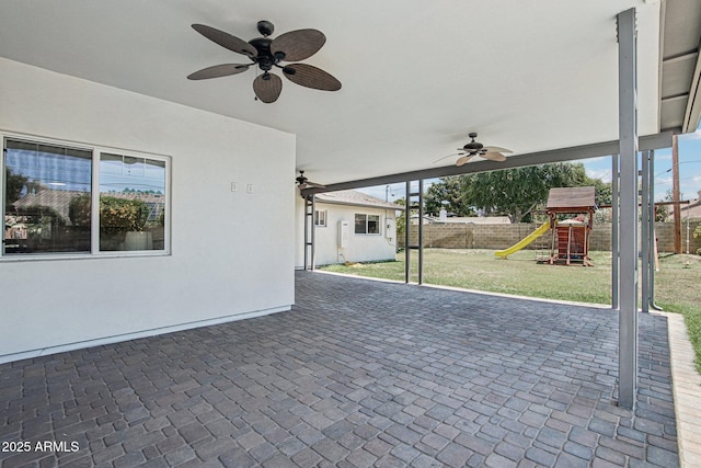 615 E Winter Dr, Phoenix, AZ 85020 - view of patio / terrace with a ceiling fan and a playground